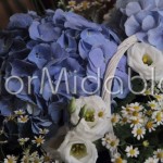 Blue hydrangeas, white lisianthus and chamomile flowers